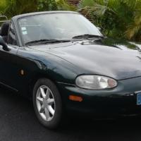  Mazda MX5
										Année : 1998
										Moteur de : 1598 cm3
										Puissance :  110 ch  DIN à  6 500  tr/min,
										Vitesse max :  191 km/h  Consommation : 7,5  l